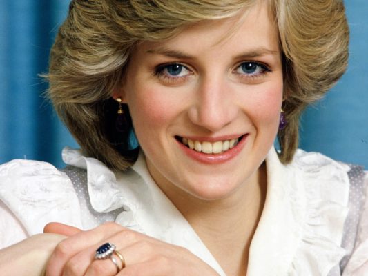 Princess Diana with her iconic sapphire wedding ring.